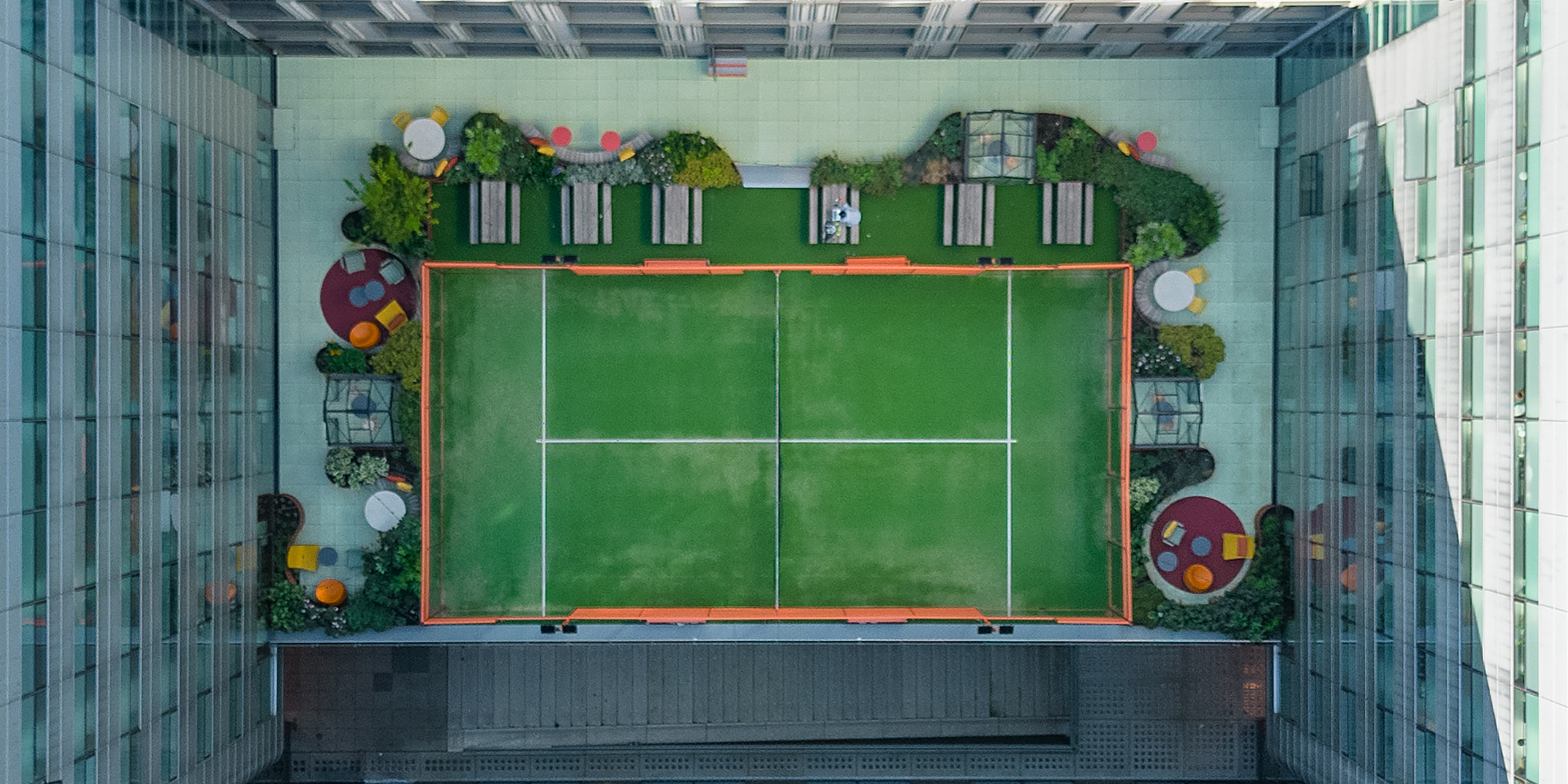 Just Eat Takeaway outdoor 
terrace with padel court >